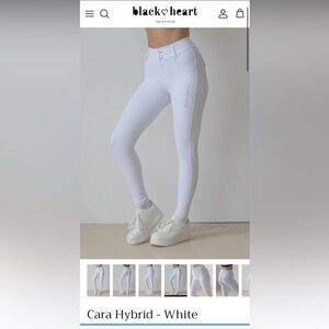 White show breeches Black heart Equestrian size xs worn once.